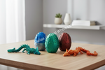 Three children excitedly play with colorful toy dinosaurs and eggs on a white table against a white background. A purple egg is cracked open, revealing a small green dinosaur.