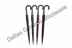 Four umbrellas of different colors on a white background