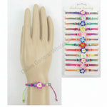 Colorful bracelets on a mannequin hand and packaging with product details.