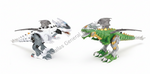 Two toy dragon-like robots on a plain white background, one primarily white and gray, and the other primarily green and gray with gold accents.