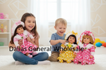 Two young children sitting on a white carpet in a bright room, surrounded by four dolls dressed in colorful polka-dot outfits. A large text overlay reads 'Dallas General Wholesale'.