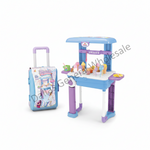 A children's play food cart set in light blue and purple, shown alongside its matching rolling storage suitcase on a white background. The cart is decorated with cartoon graphics and includes various toy food items on top.