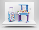 A children's play kitchen set displayed on a white platform against a light gray background, including a blue and purple play kitchen counter with colorful toy food and dishes, and a matching blue and purple rolling suitcase with printed graphics.