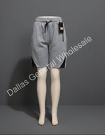 Mannequin wearing gray shorts with a dark gray background