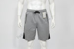 Gray shorts with black accents on a mannequin against a white background