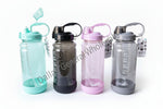 Four colorful water bottles with different colored lids on a white background.