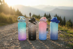 Four gradient-colored water bottles with measurement markings on a white background