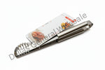 Metallic kitchen tool on a white background with a Dallas General Wholesale label.