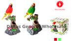 Three colorful parrot toys perched on tree branches with a recording and playing button visible in the corner. The toys are designed to mimic singing and movement.