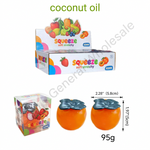 Product listing graphic for coconut oil soft stretchy toys. The image shows the product packaging, a small clear box containing two orange-colored oval stretchy toys with dark gray flower-like tops, and overlaid text including '12/box', '12box/cs', '144/cs', '1544-12SZFSL/142PCS', 'coconut oil', dimensions, and '95g'.