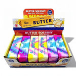 Box of Butter Squishy toys with colorful packaging on a white background