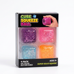 A 4-pack of gel-filled glitter squeeze balls in a clear plastic box with a black header. The four balls are purple, pink, light blue, and orange, each filled with gold glitter.