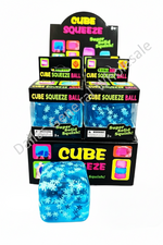 Display of Cube Squeeze balls with packaging on a white background