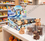 A retail display box and individual packages of 'Cute Pinocchio' animal figurines, including a blue sheep, brown bear, and tan bull, shown on a white shelf in a toy store.