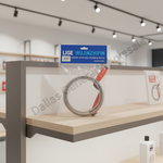 A packaged coiled metal dredging device with a blue and white LIGE WUJINZHIP label, displayed on a light wood and gray metal retail shelf inside a store.