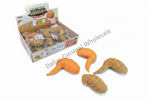 A display box of novelty toy fried chicken pieces labeled 'Fried Chicken Squishy' with several loose orange and brown textured toy pieces placed in front on a white background. A diagonal 'Dallas General Wholesale' watermark overlays the image.