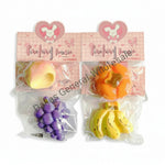 Packaging of four types of fruit-shaped kneading toys with visible brand name.