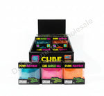 Stack of boxes containing Cube Squeeze Ball products on a concrete floor.