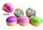 Colorful plush toys with cartoon faces on a white background