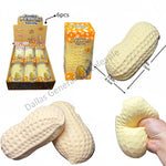 Jumbo Peanut Squeaky toy shown in a retail display box, individual packaging, loose pieces, and a hand squeezing one to demonstrate the squishy texture. The image includes dimension labels and a red text overlay reading '6579 48pcs'.