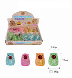 Display box of decompression toys with colorful bears and text on a white background