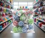 A large clear plastic bag filled with multiple rope dog toys in red, white, blue, green, and multicolor patterns, placed on a counter inside a pet store aisle. Shelves with pet supplies are visible in the background.