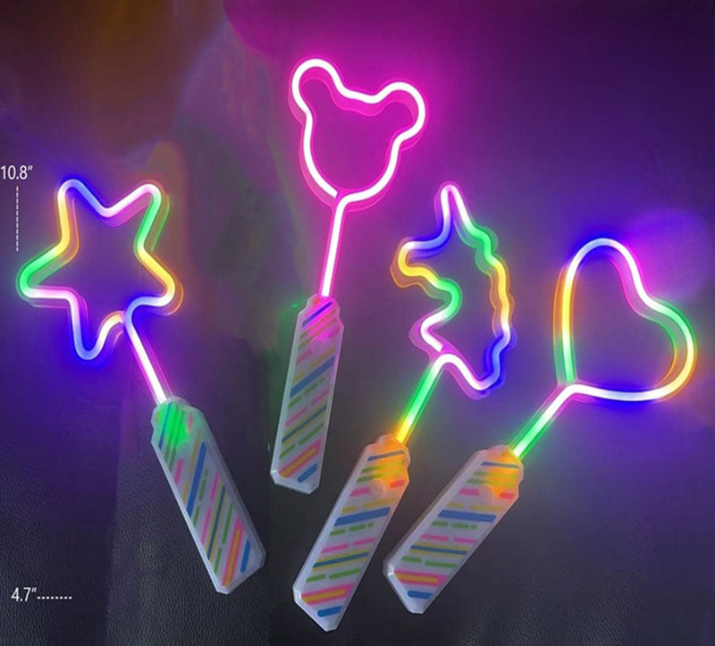 Set of colorful neon light sticks with star, heart, and candy cane shapes on a dark background.