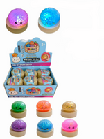 Colorful small round lights with a display box on a white background