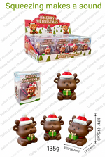 Christmas-themed brown bear figurines with Santa hats and green gift boxes, shown with retail packaging and measurement labels on a white background. Text at the top includes product code 1531-12SDXJM/144PCS and 'Squeezing makes a sound'.