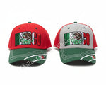 Two red, green, and gray baseball caps with a Mexican flag graphic and 'MEXICO' text, displayed on a concrete floor in a store aisle.