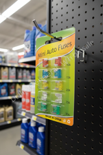 Pack of mini auto fuses on a pegboard in a store setting