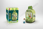Claw machine toy with packaging and features on a green background