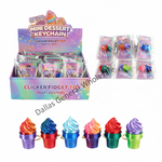 A display box and individual packs of Mini Dessert Keychain Clicker Fidget Toys, with six colorful ice cream cone-shaped fidgets shown at the bottom. The products feature metallic, iridescent finishes in multiple colors.