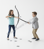 A girl in a light blue t-shirt and jeans aims a bow and arrow, while a boy in a gray hoodie and khaki pants defends herself from a toy sword, on a white studio background with scattered toy swords.