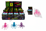 Display of 'Super Solid Squish' cube squeeze balls with packaging and product samples.