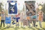 Toy set with blue and brown police-themed items on a grassy background with children playing.