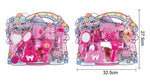 Pink toy beauty set in retail packaging, shown twice side by side with printed dimensions and product details. The set includes a hair dryer, mirror, brush, comb, perfume bottle, and other pink accessories.