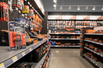 Tool store with shelves stocked with tools and a close-up of a tool set packaging.