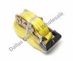 A packaged yellow flat towing strap with a black handle, wrapped in clear plastic with a white barcode label, resting on a concrete floor.