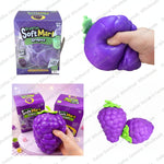 Squishy toy set of soft grapes and raspberries in purple with green leaves, shown with retail boxes, a hand squeezing one grape, dimensions, and quantity text on a white collage background.