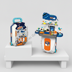 A children's toy space-themed play set displayed on a white pedestal against a light gray studio background. The set includes a suitcase-shaped storage case on the left and a multi-level space station/play area on the right, both in blue, white, and orange.
