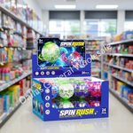 A retail display box of Spin Rush toy soft balls with colorful glowing spheres inside, set on a store shelf with blurred aisles in the background.