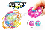 A multicolor translucent spinning top toy shown on a white background, with a hand holding one version, large 'SPINNING TOP PRESS' text, motion graphics, and small size measurements.