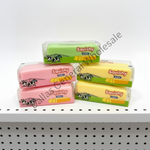Four packaged Squishy Butter erasers in pink, yellow, and green colors, stacked on a white shelf. The products are in clear plastic packaging with colorful labels featuring the brand name 'Squishy Butter' and a cow illustration.