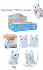 White cat-shaped squishy toys shown with their retail boxes, a hand squeezing one toy, dimensions, weight, and text noting that squeezing makes a sound. The image is collage-style on a white background.