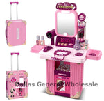 Pink toy vanity set with mirror, stationery items, and a suitcase on a white background.