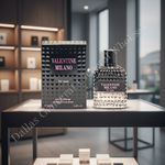 Valentine Milano perfume bottle and packaging on a table in a modern interior setting