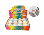 Box of 'Pinch Family' play balls with colorful packaging and a close-up of a hand holding one.