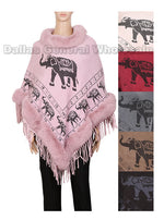 A woman wearing a pink knitted poncho with an elephant pattern and a faux fur collar.