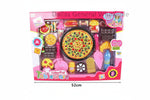 A colorful toy pizza play set displayed in an open window box, featuring various plastic dessert time toys such as pizzas, drinks, and desserts arranged on a large plate.